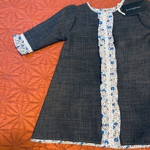 Hand-made child’s dress, ruffled cuffs and bodice
